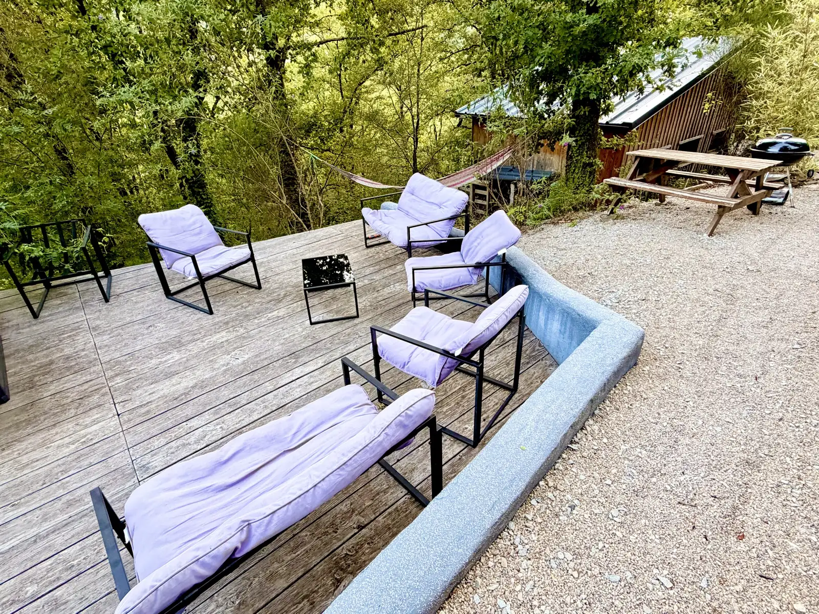 Outdoor lounge and hammock on the wooden deck